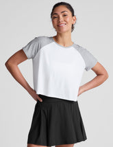 white relaxed fit t-shirt with colorblock raglan sleeve and neck binding.